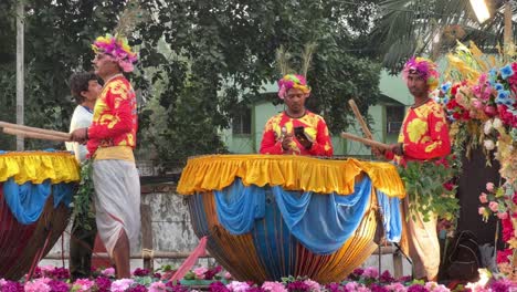 tribal drummers practicing at durga puja procession at red road in kolkata, india.