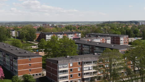 Modern-living-apartment-buildings-in-Sweden-city,-aerial-orbit-view