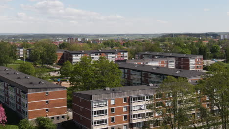 modern living apartment buildings in sweden city, aerial orbit view