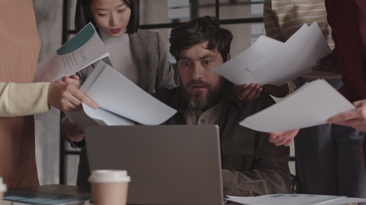Caucasian Businessman Overwhelmed by Paperwork