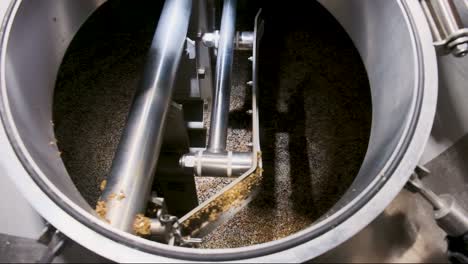 grain being mixed in the mash tun during the beer brewing process