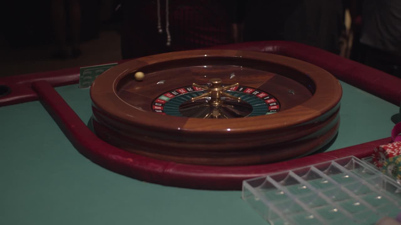 Black female woman spinning roulette wheel and spinning ball