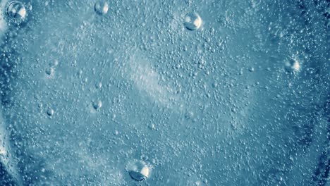 oxygen bubbles in water on a blue abstract background