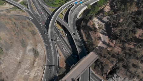 aerial static shot of highway overpass with traffic on a sunny day in santiago de chile, 4k