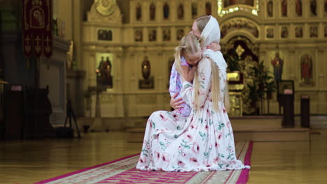 mother and daugher in the church