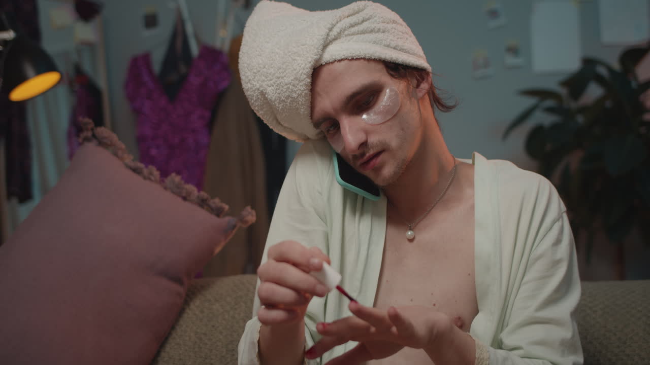 Man Multi-Tasking with Beauty Routine and Phone Call