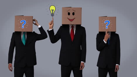 Team-of-businessman-hiding-head-with-box-and-gesturing