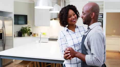 Couple-dancing-together-in-kitchen-4k