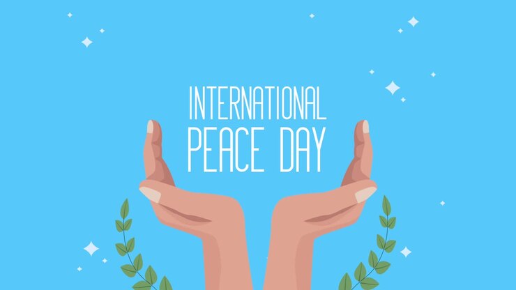 international peace day lettering with hands and wreath