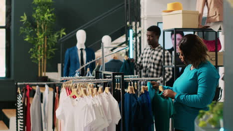 store manager helping stylish customer