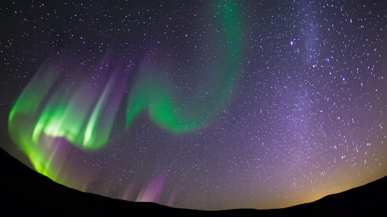 Aurora Borealis Over a Starry Night Sky