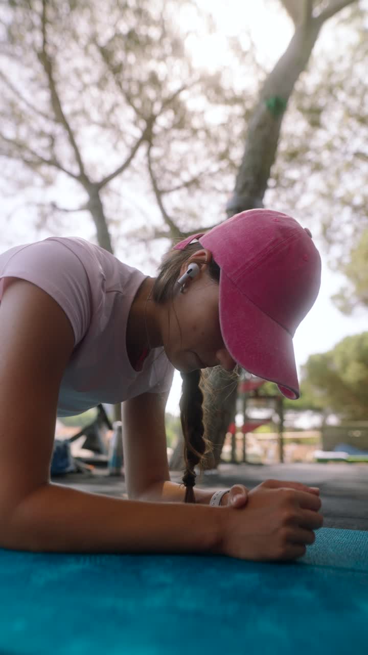 Young Woman Doing Plank Exercise Outdoors