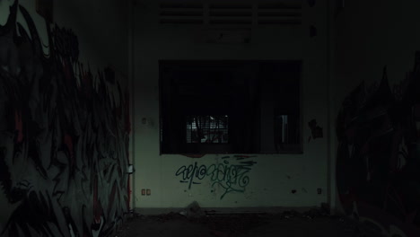 graffiti-covered abandoned building interior