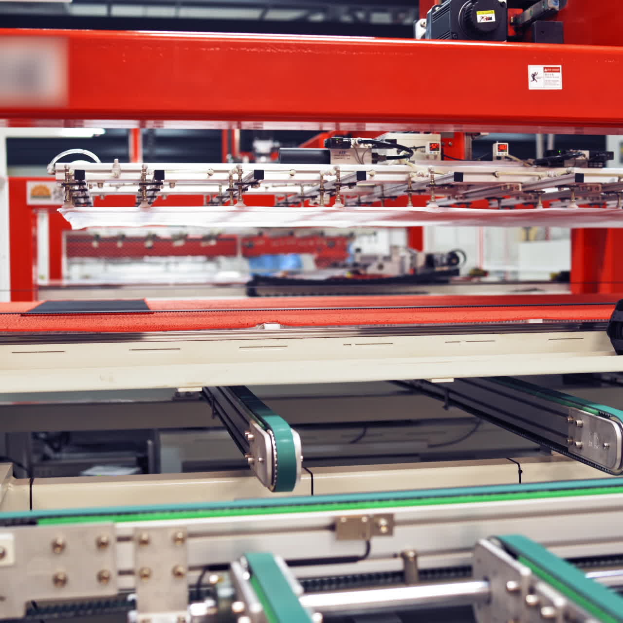 Industrial robot working at solar pannels production factory,Conveyor Tracking Controler of robotic hand. Green energy concept.