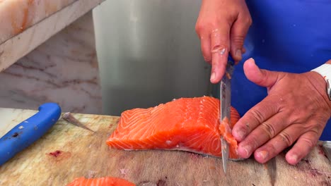 filleting fresh salmon