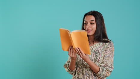 Woman-reading-interesting-book,-enjoying-hobby,-being-entertained