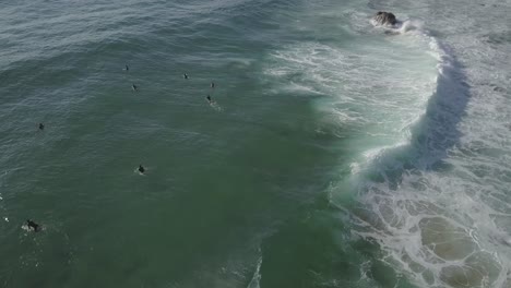 Aerial-view-of-Guincho-spot-on-a-sunny-day-with-blue-sea,-Cascais-Portugal