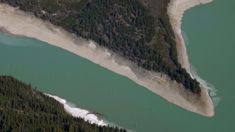 scenic view of shaggy forest mountains at downton lake reservoir in british columbia, canada