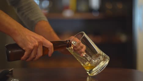 close up of opening bottle of beer. opening and serving beer