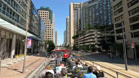city tour bus ride through downtown cityscape