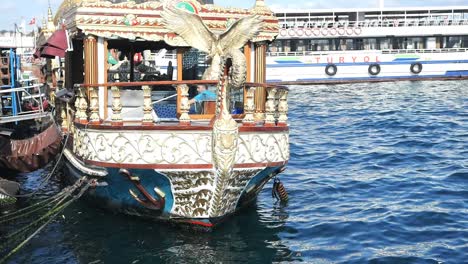 ornate turkish boat docked at the golden horn in istanbul, turkey