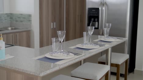 breakfast-area-with-chairs-and-glasses-and-dishes-in-the-kitchen