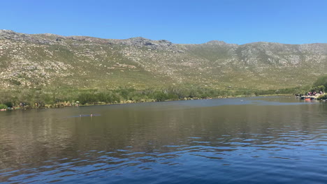 panning footage across the dam in the silvermine section of table mountain national park, cape town, south africa
