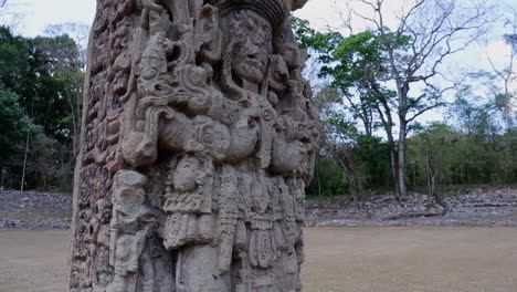 tilt down ornate carved stele stone at copan mayan ruins in honduras