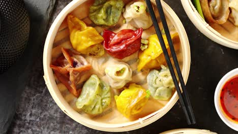 oriental traditional chinese dumplings served in the wooden steamer