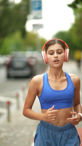 woman running outdoors with headphones