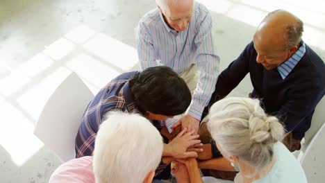 group of people forming handstack 4k