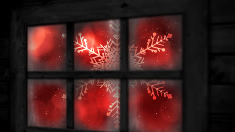 animación de la nieve cayendo sobre el copo de nieve de navidad visto a través de la ventana