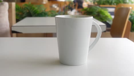 empty coffee cup on a table in a cafe