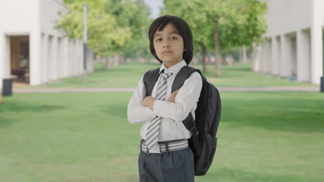 Portrait-of-Confident-Indian-school-boy-standing-crossed-hands