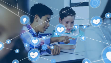 in school, boys using laptop with animation of digital health and technology icons