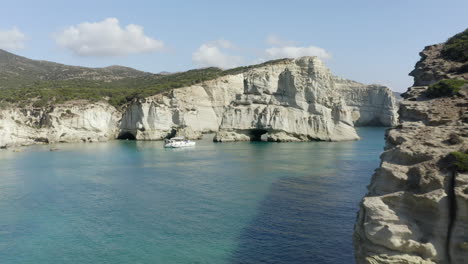 klefitko beach and white cliffs drone aerial shot over the blue waters and dramatic coastline of the greek island of milos, greece in 4k