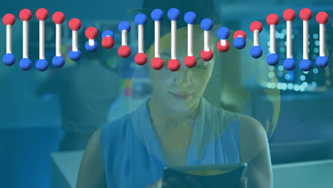 animation of dna strand spinning, globe and connections over woman using tablet