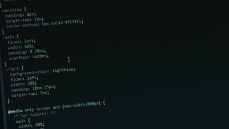 code programming screen with different colours being navigated by scrolling with close up pixel details html - focus pull footage 4k