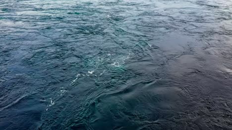 waves of water of the river and the sea meet each other during high tide and low tide.