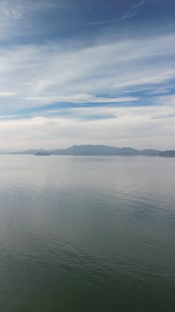 A vertical aerial drone view of Point Molate Beach in the late afternoon.