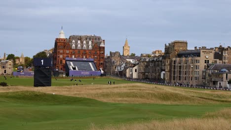 golf course with historic buildings in background