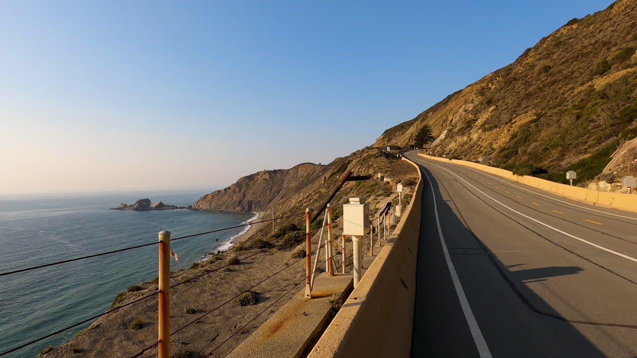 4K60 Closed Section of Route 1 in Northern California along the magnificent cliffsides and the Pacific Ocean on a warm summer afternoon as the sun begins to set