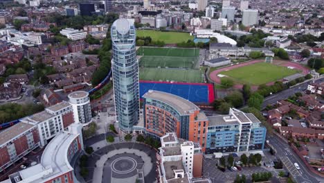 high rise buiding at the shopping center of gunwharf quays with a view of hms temeraire facility in the british city of portsmouth