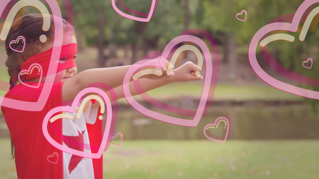 In school, child wearing superhero costume with heart animation in playground