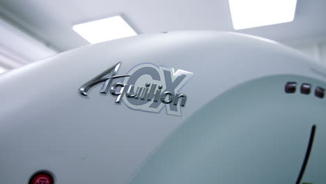 Upper part of the modern innovative tomography equipment in the hospital. Brand name on the Toshiba MRI machine.