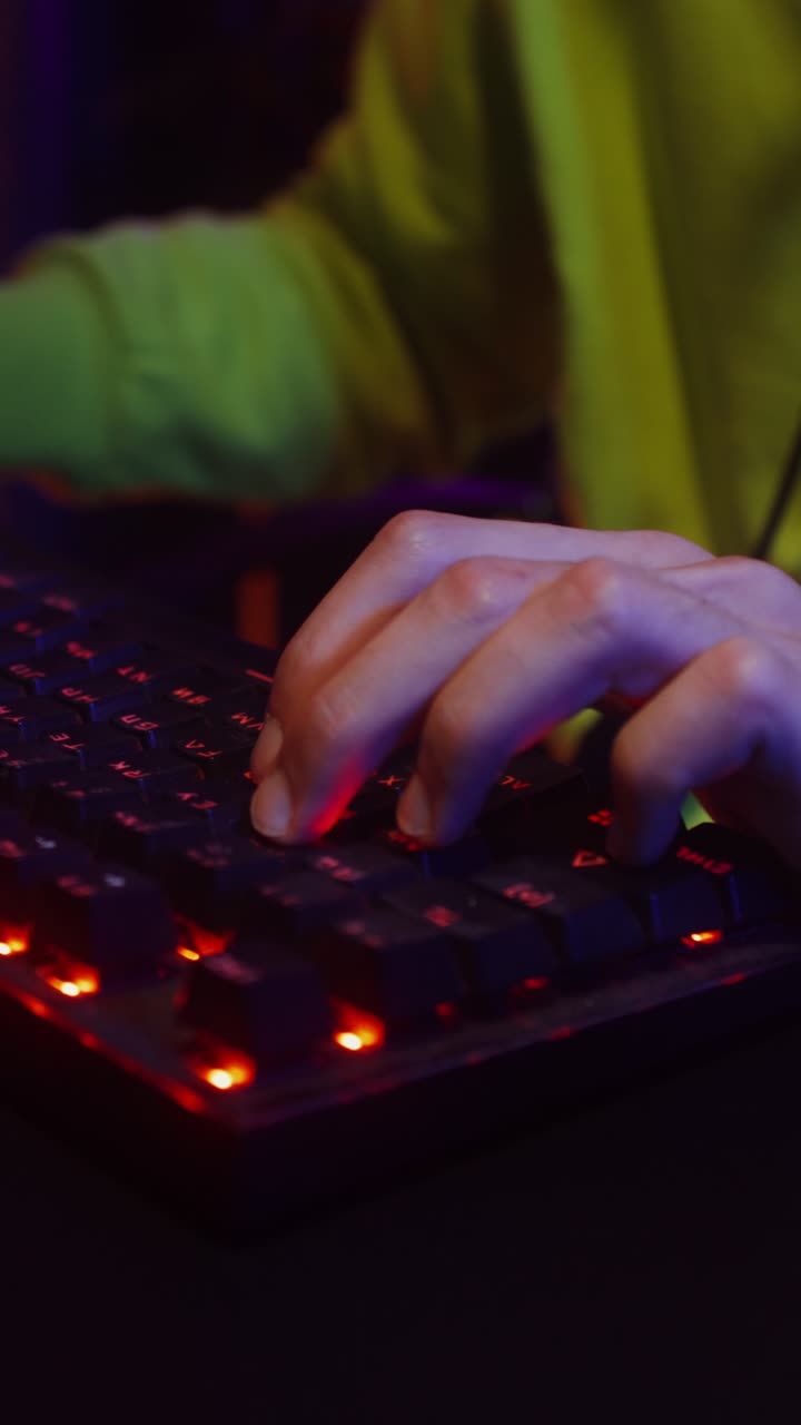 Close-up of hands gaming on a keyboard