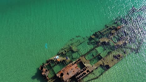 greece's coastal treasure: a day of sun and waves at epanomi beach with the shipwreck from above