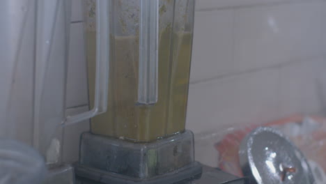 Close-Up-of-Green-Juice-Being-Blended