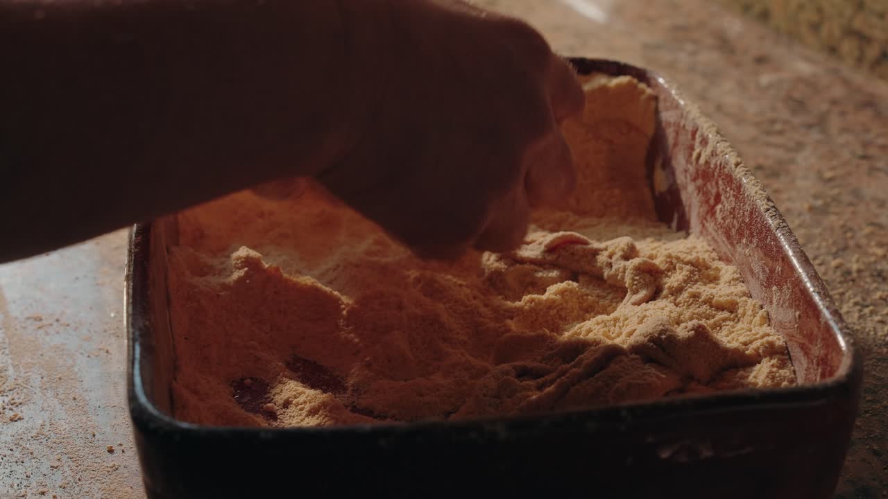 tripes rolled in yellow flour by hand inside rustic metal tray