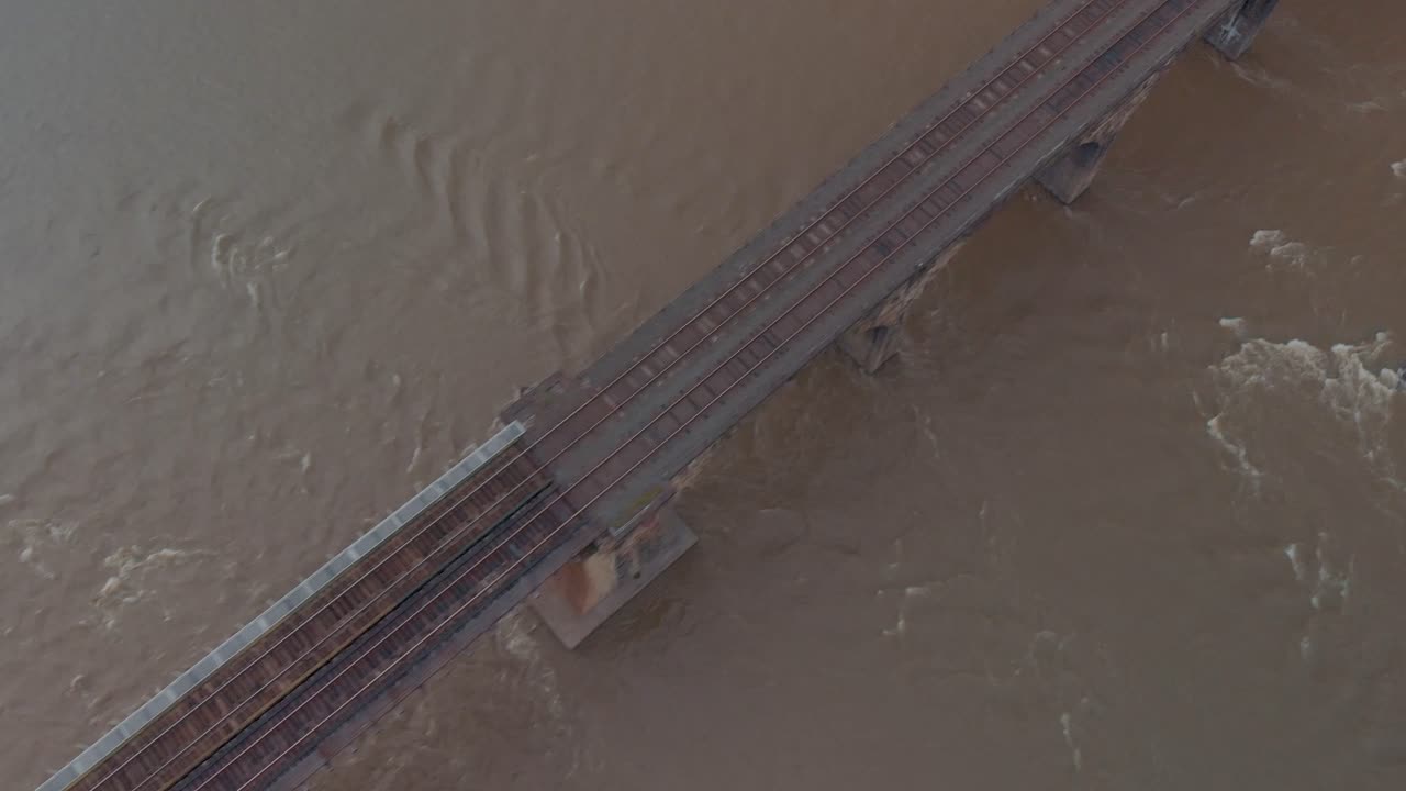 Drone footage of train bridge and tracks in Lancaster, Pennsylvania - Cold Color Grade